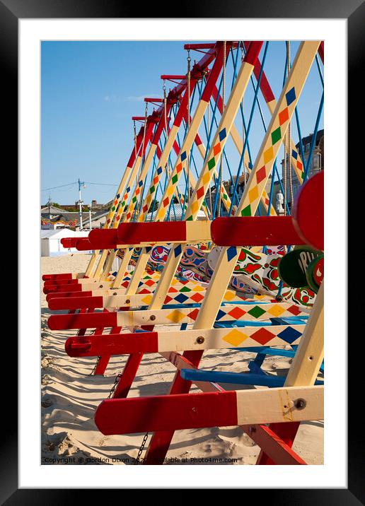 Colourful swing boats on the beach at Weymouth  Framed Mounted Print by Gordon Dixon