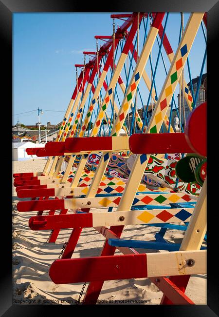 Colourful swing boats on the beach at Weymouth  Framed Print by Gordon Dixon