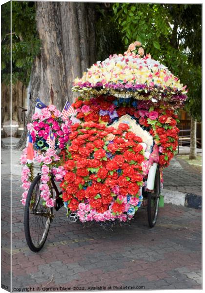 Eccentric floral decorations on pedal powered trishaw - Melaka. Malaysia Canvas Print by Gordon Dixon