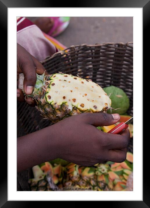 Preparing a pineapple for eating - roadside seller, Ghana Framed Mounted Print by Gordon Dixon