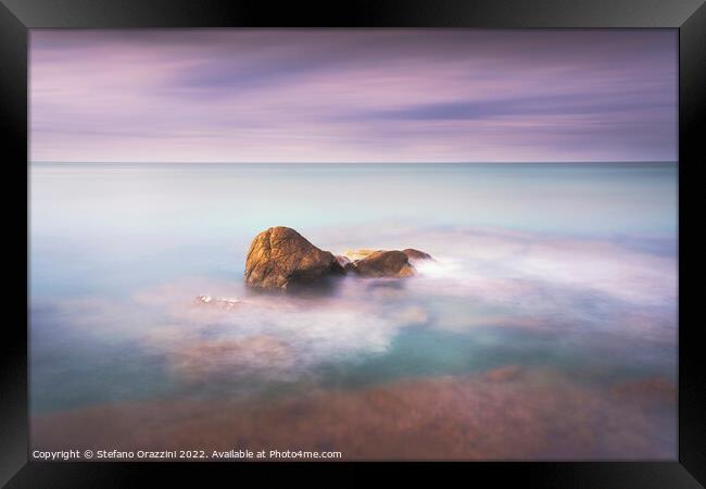 Rock and sea, long exposure photography. Framed Print by Stefano Orazzini