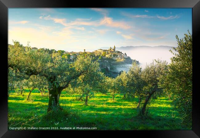 Trevi picturesque village and olive trees in a foggy morning. Framed Print by Stefano Orazzini