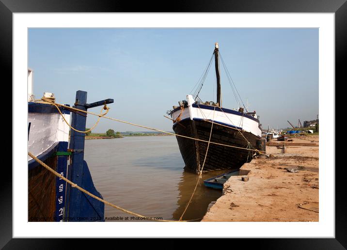 Old wooden cargo vessels undergoing repair - Mangalore, India Framed Mounted Print by Gordon Dixon