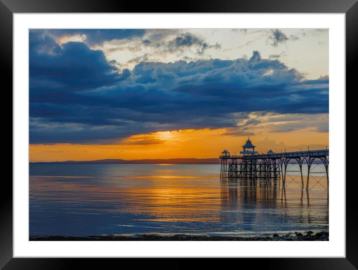 Clevedon Pier at sunset on a calm and cloud evening Framed Mounted Print by Rory Hailes