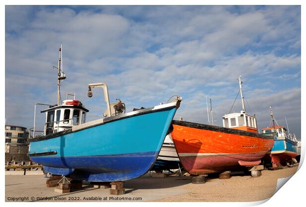Orange and blue fishing trawlers on quay in winter Print by Gordon Dixon