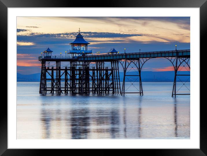 Clevedon Pier at sunset with reflection Framed Mounted Print by Rory Hailes