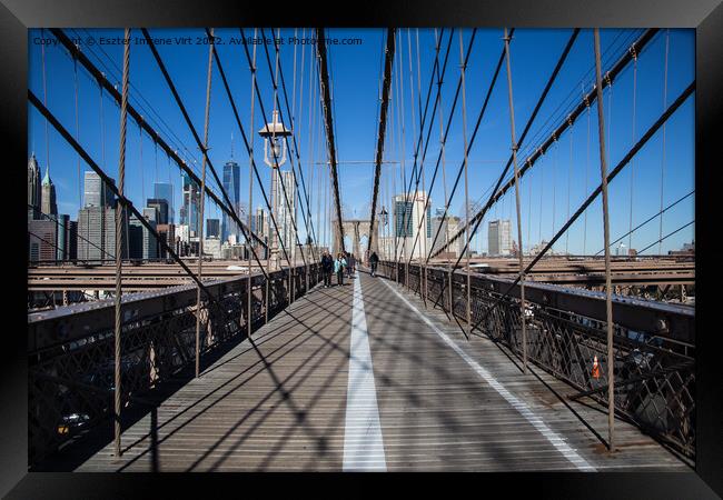 The skyline of Manhattan from the Brooklyn Bridge  Framed Print by Eszter Imrene Virt