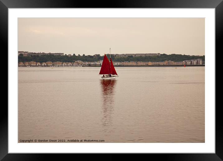 Yacht with red sails set approaches Cardiff Bay, South Wales Framed Mounted Print by Gordon Dixon