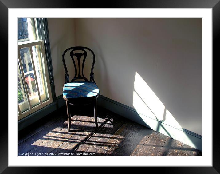Chair in a empty room. Framed Mounted Print by john hill