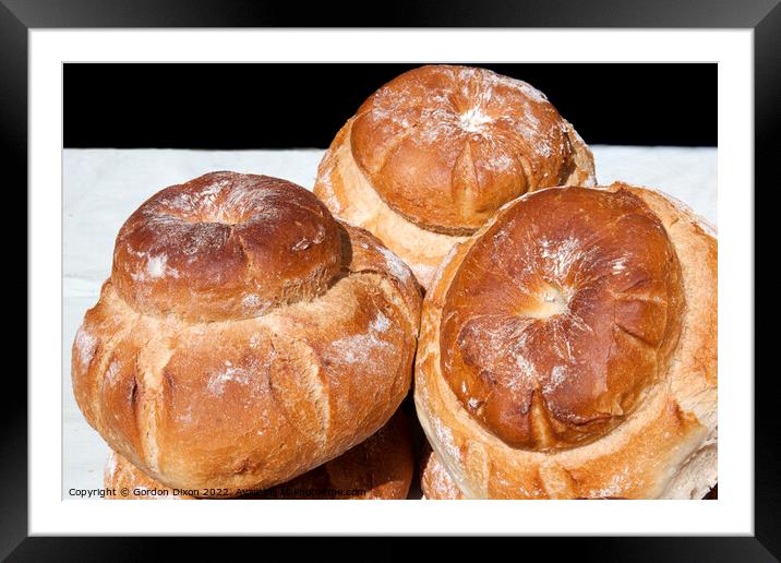 Freshly baked cottage loaves on a baker's stall  Framed Mounted Print by Gordon Dixon