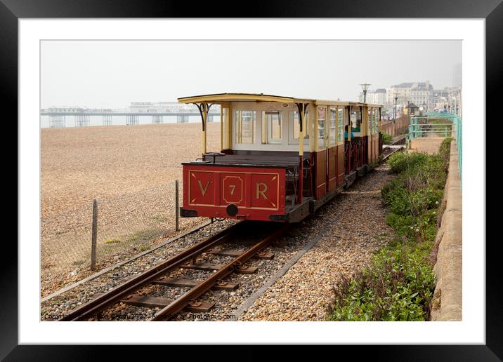 The Volks narrow gauge electric railway on Brighton beach  Framed Mounted Print by Gordon Dixon