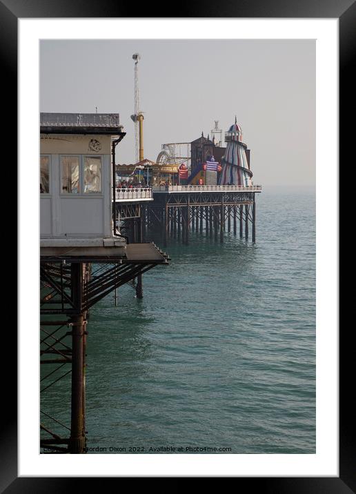Brighton pier amusements - funfair over the sea Framed Mounted Print by Gordon Dixon