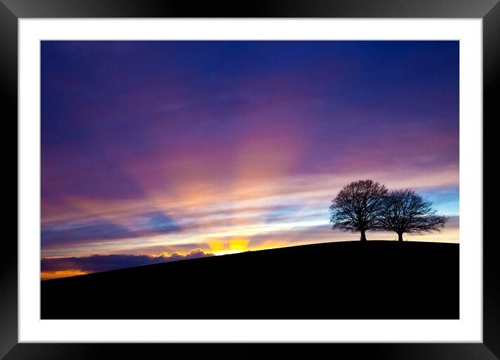 Dramatic sunset behind Spir Hill with sunbeams Framed Mounted Print by Gordon Dixon