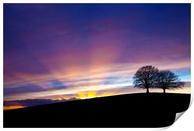 Dramatic sunset behind Spir Hill with sunbeams Print by Gordon Dixon