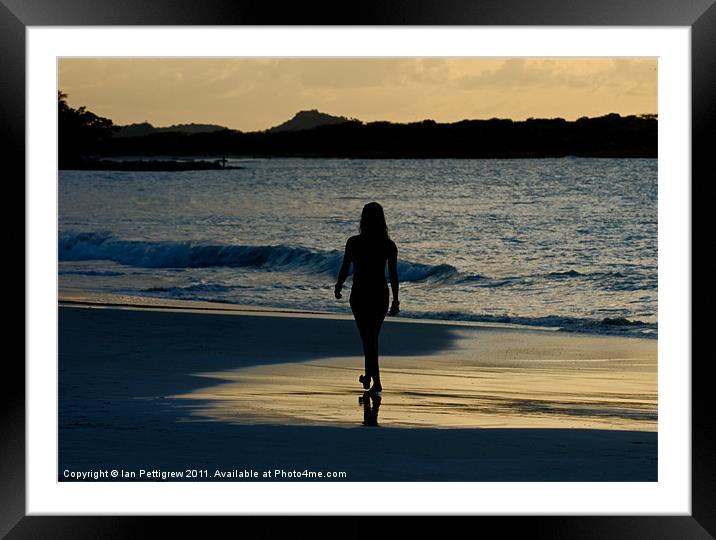 Girl walking on the beach Framed Mounted Print by Ian Pettigrew