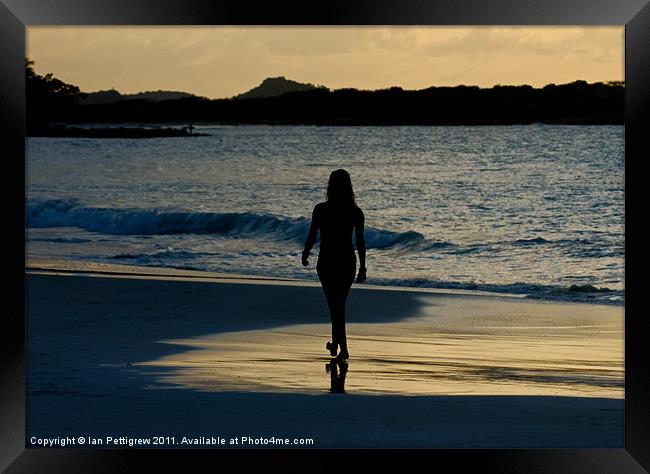 Girl walking on the beach Framed Print by Ian Pettigrew