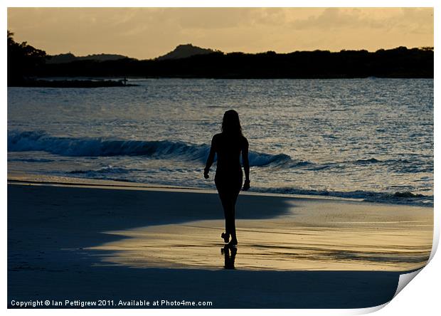 Girl walking on the beach Print by Ian Pettigrew