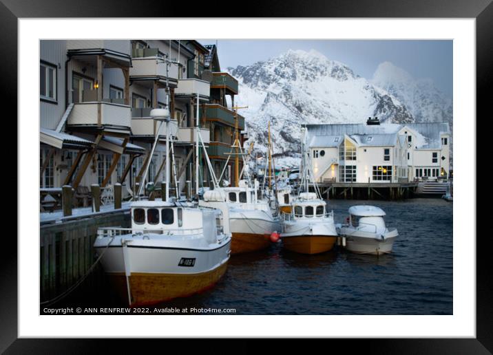 Norwegian fishing village in winter. Framed Mounted Print by ANN RENFREW