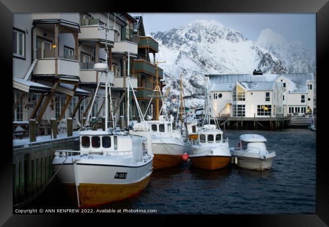 Norwegian fishing village in winter. Framed Print by ANN RENFREW