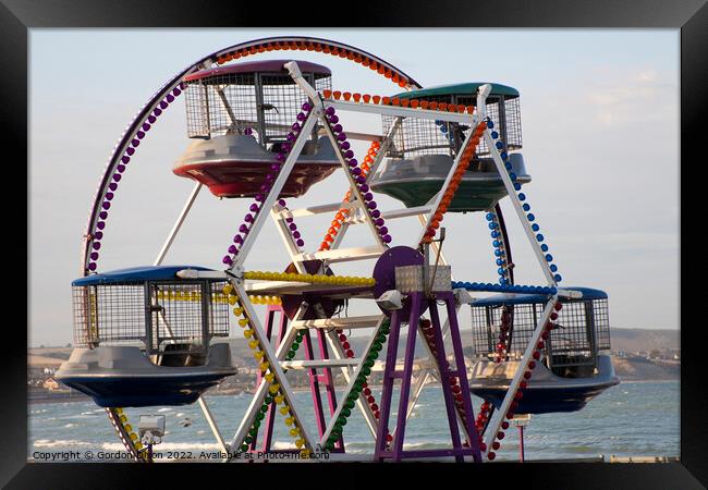 Childrens Ferris Wheel on Weymouth promenade Framed Print by Gordon Dixon