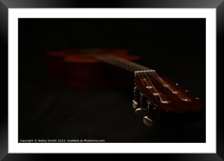 Guitar in the dark. Framed Mounted Print by Bobby De'ath