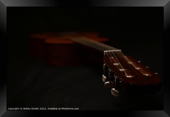 Guitar in the dark. Framed Print by Bobby De'ath