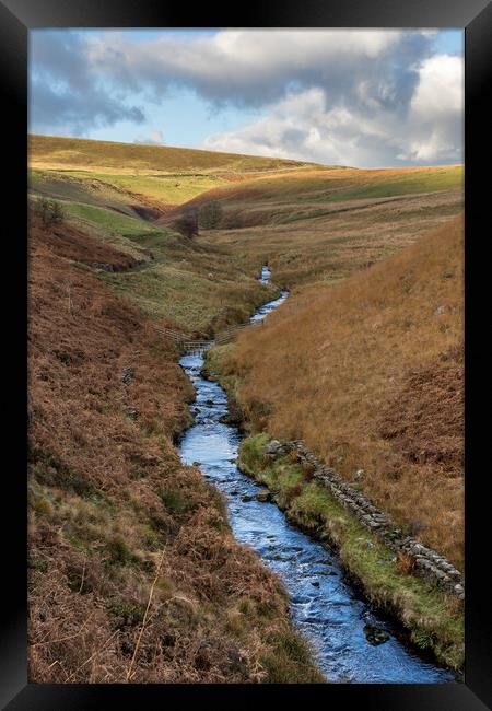 River Dane flowing down a valley Framed Print by Jason Wells