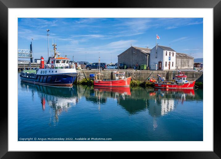Boats on quayside at Stromness harbour in Orkney Framed Mounted Print by Angus McComiskey