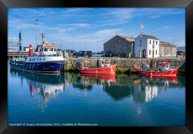 Boats on quayside at Stromness harbour in Orkney Framed Print by Angus McComiskey