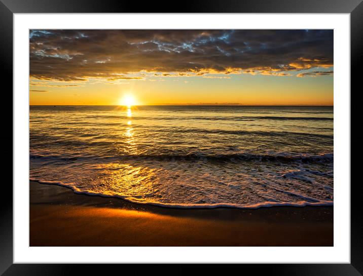 Photography with the sun between the sea and the clouds at a sunrise on the beach Framed Mounted Print by Vicen Photo