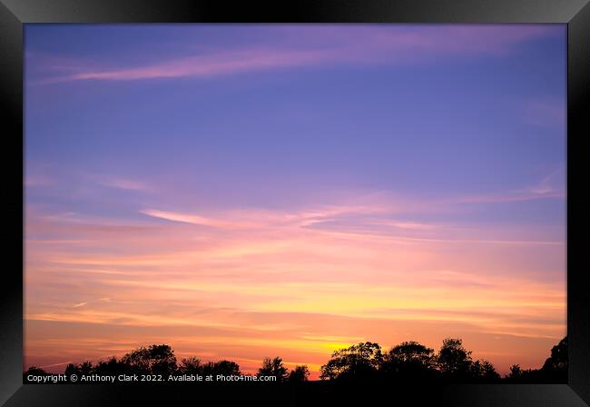 Clouds at sunset Framed Print by Anthony Clark