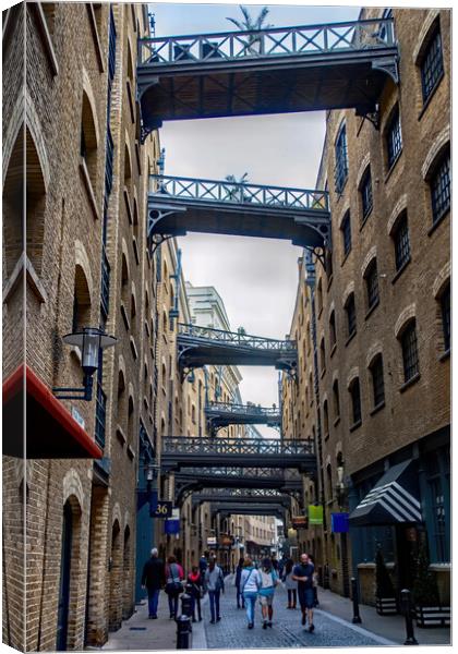 Shoppers in Shad Thames Canvas Print by Joyce Storey