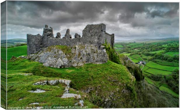 Carreg Cennen Castle with moody clouds Canvas Print by Chris Drabble