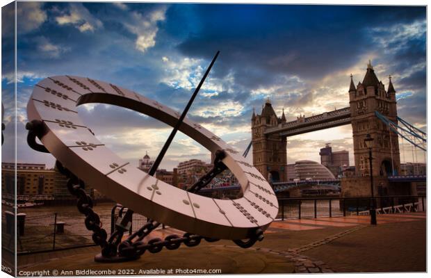 Sundial with tower bridge  Canvas Print by Ann Biddlecombe
