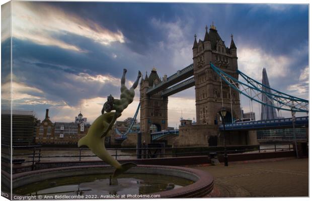 A statue in front of Tower Bridge Canvas Print by Ann Biddlecombe