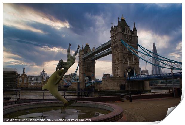 A statue in front of Tower Bridge Print by Ann Biddlecombe