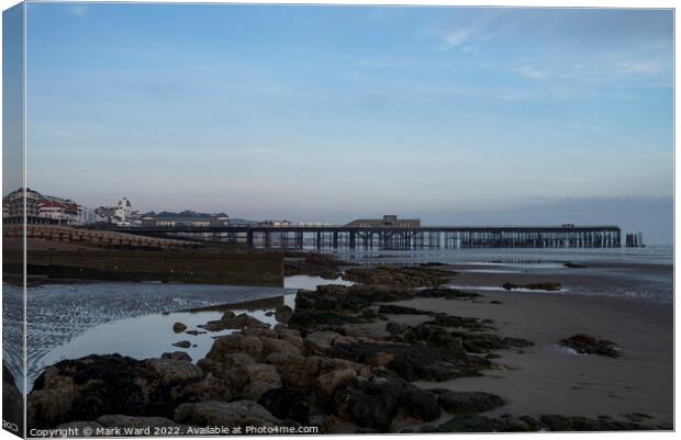 Hastings Pier at Low Tide. Canvas Print by Mark Ward