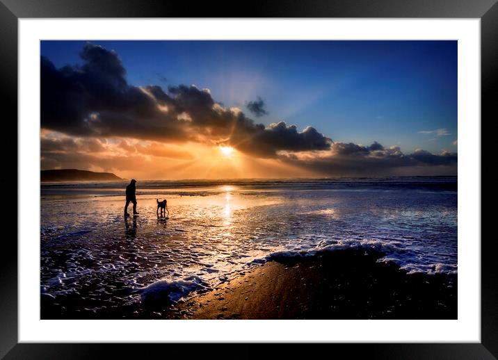 A dog walker at Widemouth Bay, Bude Cornwall. Framed Mounted Print by Maggie McCall