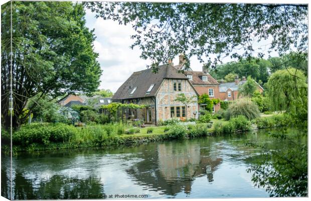Quaint riverside cottage on the bank of the River Test, Hampshire Canvas Print by Chris Yaxley