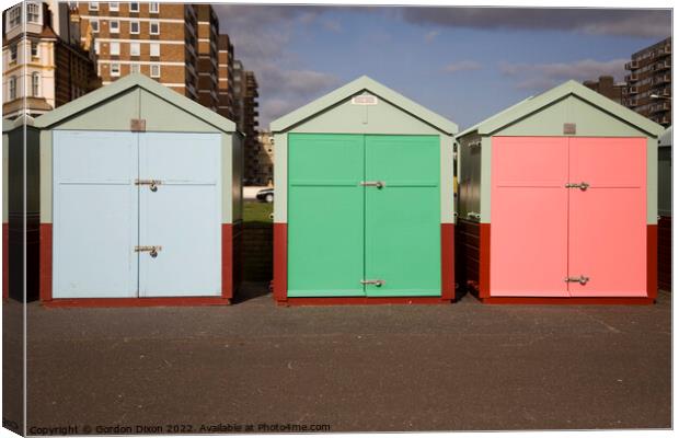 Three beach huts in pastel shades - Brighton Canvas Print by Gordon Dixon