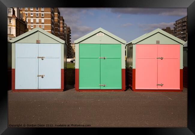 Three beach huts in pastel shades - Brighton Framed Print by Gordon Dixon