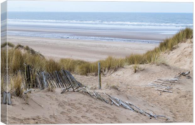 Fallen fence leading down to Formby beach Canvas Print by Jason Wells