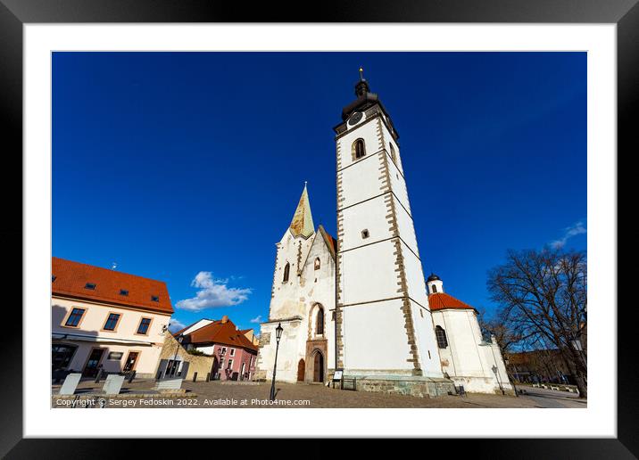 Gothic church of the Nativity of the Blessed Virgin Mary and clock tower. Pisek - town in South Czechia. Framed Mounted Print by Sergey Fedoskin