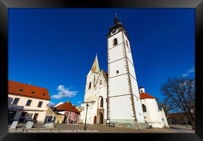 Gothic church of the Nativity of the Blessed Virgin Mary and clock tower. Pisek - town in South Czechia. Framed Print by Sergey Fedoskin