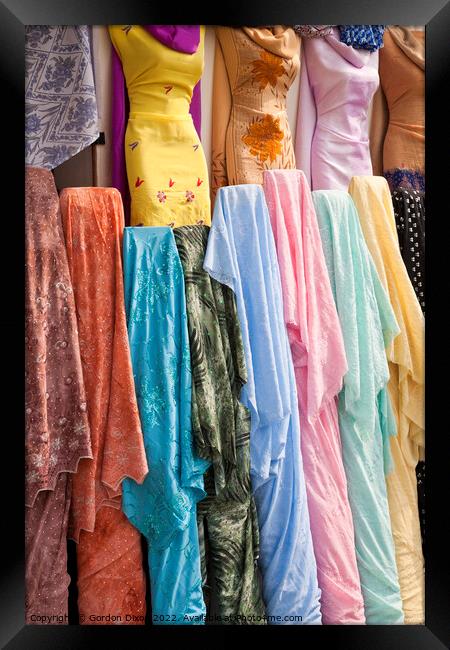 Colourful Arabian Ladies clothing - Dubai Framed Print by Gordon Dixon