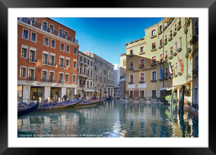 Gondolas on the canals of  Venice Framed Mounted Print by Angela Wallace