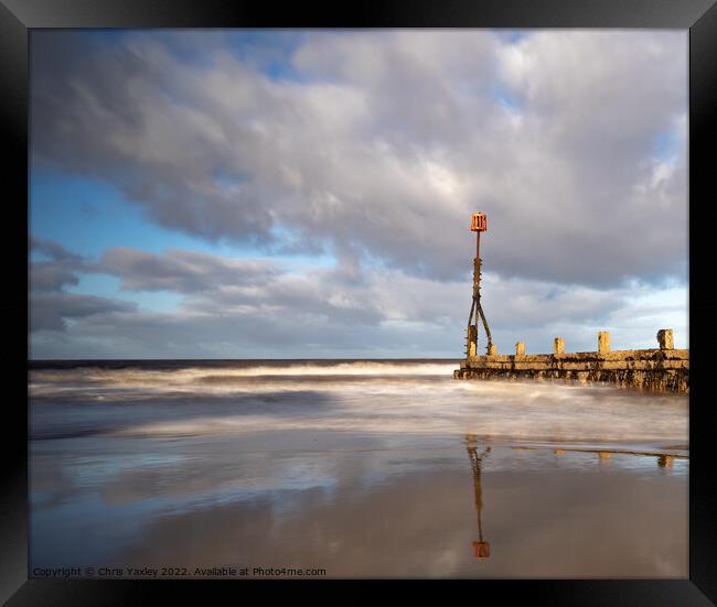 Long exposure image of wooden sea breakers, Cromer Framed Print by Chris Yaxley