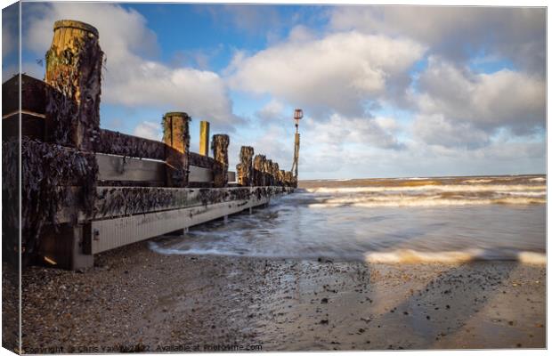 Long exposure of wooden breakers on Cromer beach Canvas Print by Chris Yaxley