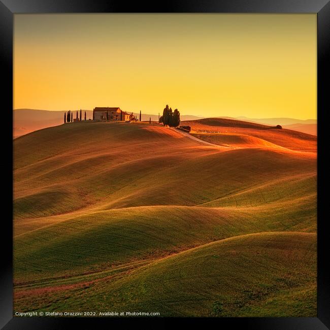 Tuscany, Rolling hills and countryside farm at sunset Framed Print by Stefano Orazzini