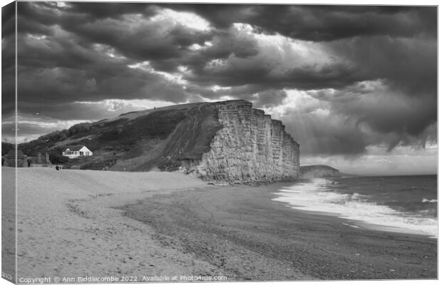 Black and white West bay beach and cliffs Canvas Print by Ann Biddlecombe